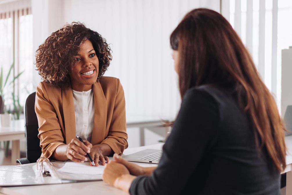 Woman consulting with  loan officer 